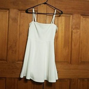Fit and flare white dress with cut out back
